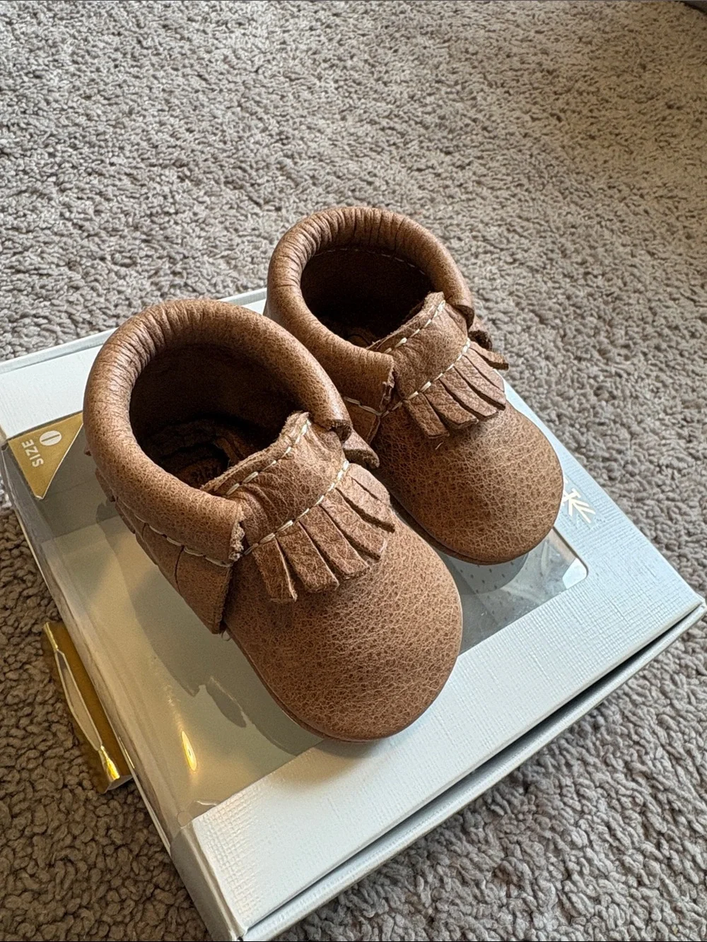 Freshly picked newborn weathered brown moccasins